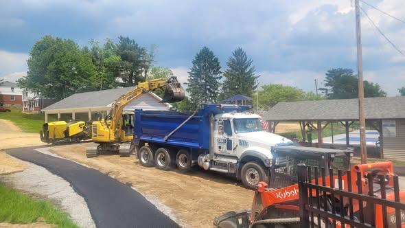 Paving crew and truck at Dallas Memorial Park